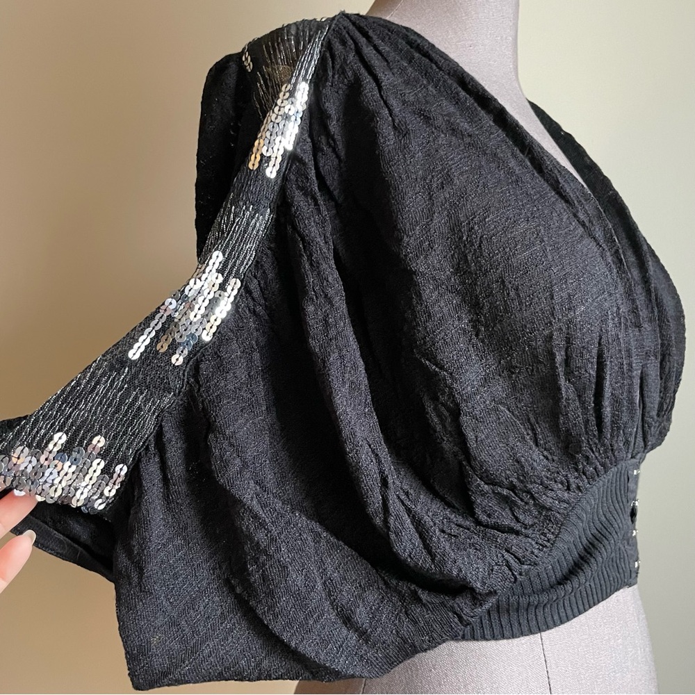 Free People short sleeved shrug with sequin trim on shoulders